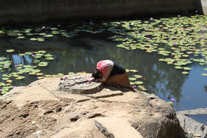 Nina praying at the padukas of Krishna