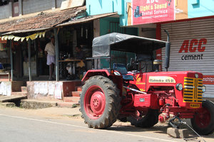 tractor repair and in the background a tailor
