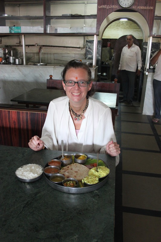 happy Nina with a delicious vegan thali