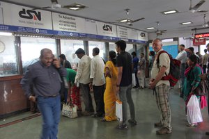 buying a train ticket at the Masjid Train Station
