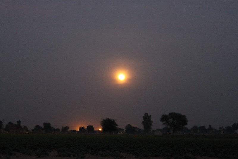 full moon over the fields surrounding Vrindavan