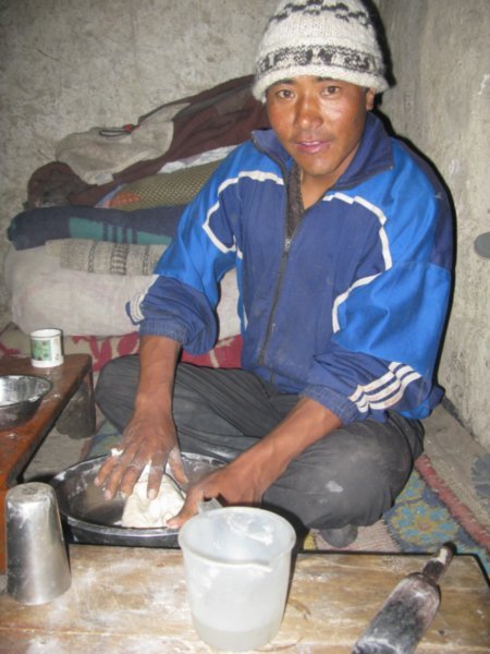 making momos and keeping warm round the fire in summer!f dinner in Rumbak village, Ladakh