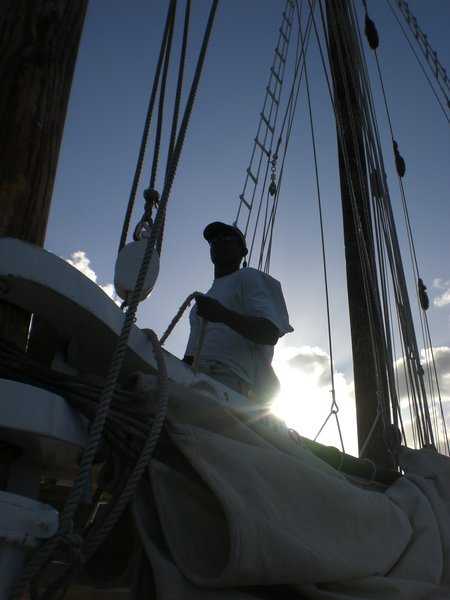Leah gathers the sails