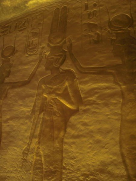 Amun (king of Gods) in between 2 Hathors (Goddess of Love)