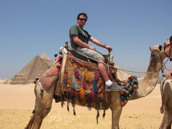 Camel ride with the Pyramids of Giza in the background