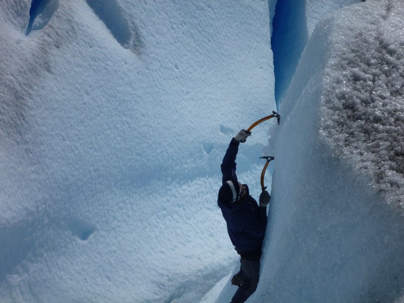 Our other guide climbing up a steep ice wall