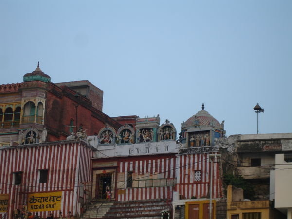 Buildings with statues alongside the Ganges