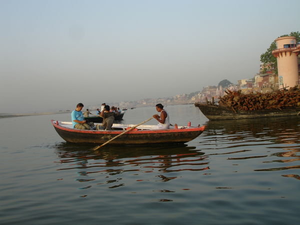 Boat along side boat full of wood for the cremations performed on some of the Ghats