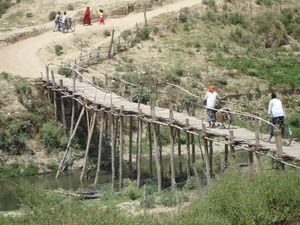 Rickety bridge over tributary as it flows into the Ganges