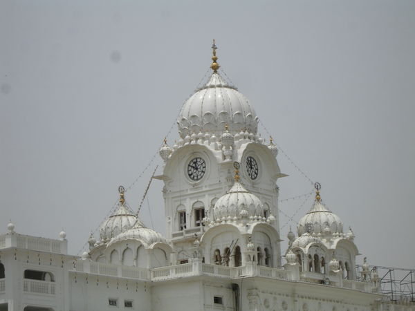 White marble building adjacent to Golden Temple