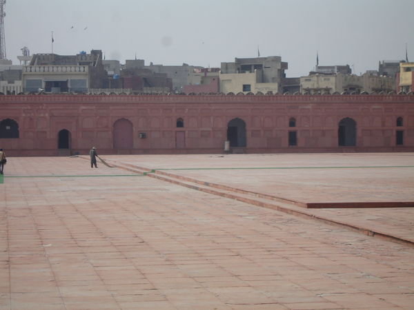 Sweeping the Mosque courtyard