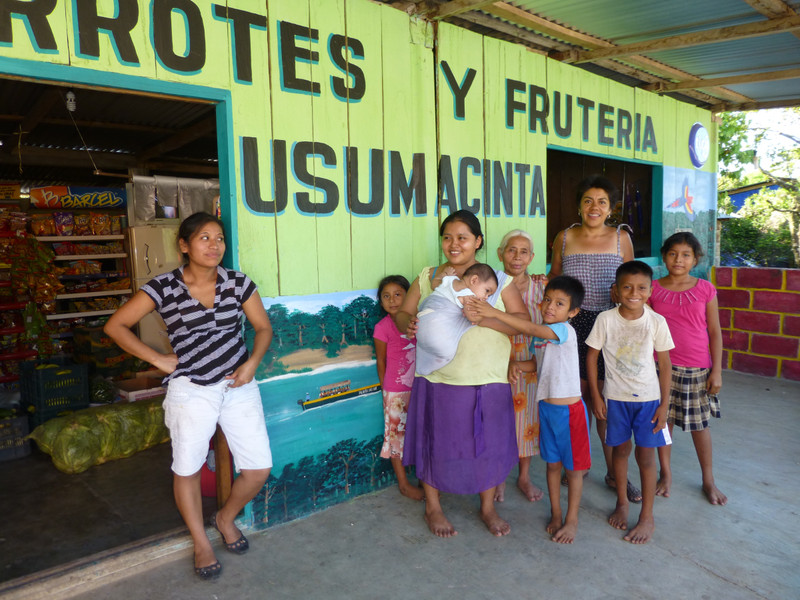 Iliana and the Frontera Corozal family in front of their shop