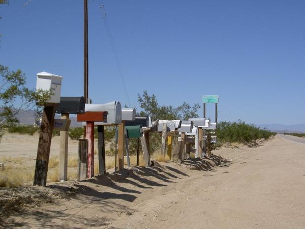 Bunch of letterboxes on the side of the road