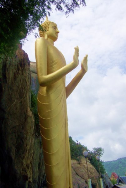 Massive Golden Buddha Overlooking Sea
