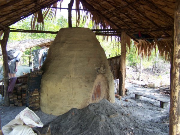 Moken clay oven for burning mangrove wood to make charcoal