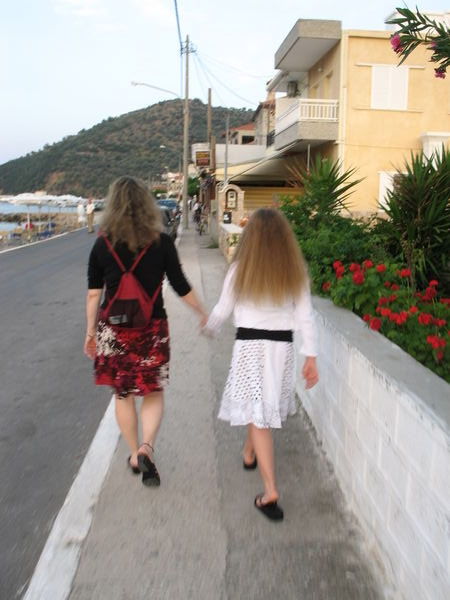 walking down a street in Tiros