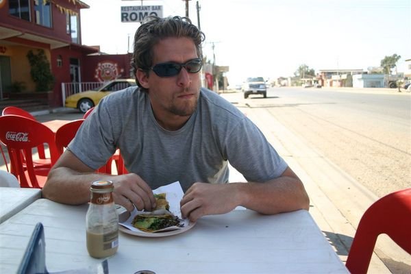 Rob eating a roadside taco in San Quintin