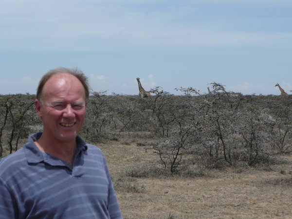 my dad and a giraffe on his birthday