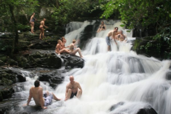 Group photo in the multilevelled waterfalls near the homestay