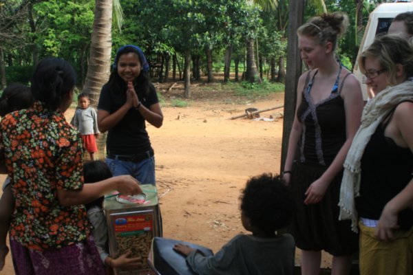 The ceremonial handing over of the biscuits at the homestay