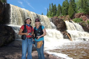 Linda and Karen using the Middle Gooseberry Falls as a backdrop for their photo.