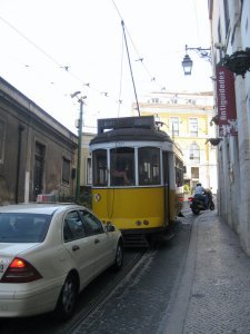 tram in steep, narrow street nearby