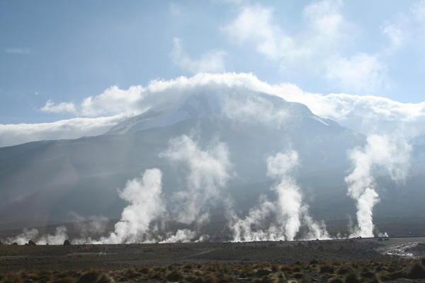 some geysers with a volcano