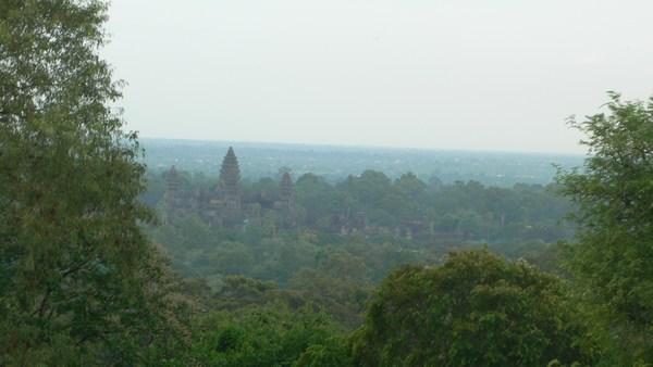 Angkor Watt (in distance) from Phnom Bekheng at sunset