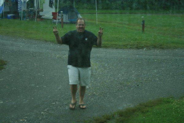 My crazy husband playing in the rain ! If you can't beat 'em, join 'em !