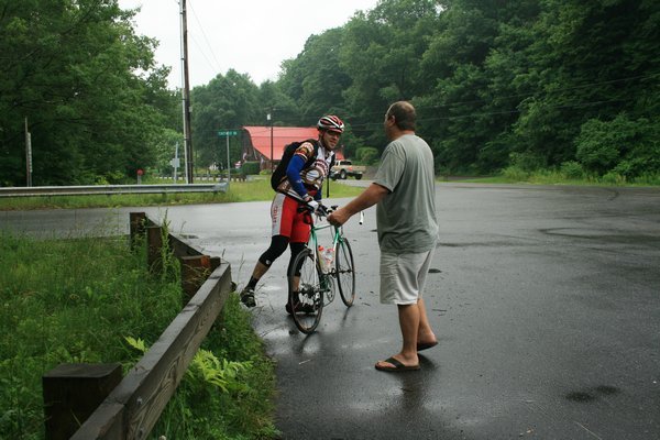 Tim talking to the cyclist about the weather.