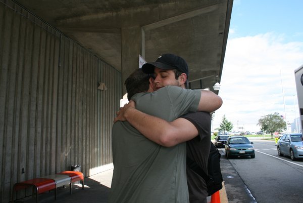 Tim hugging Jon good bye at the airport.