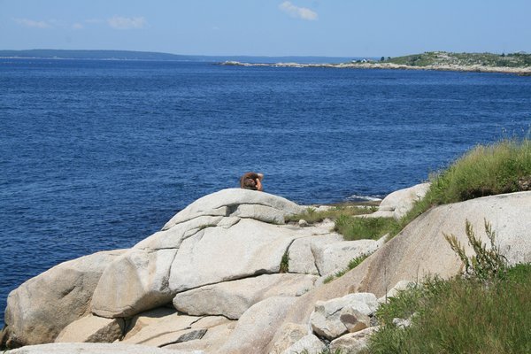 Tim taking a nap on the rocks in Peggy's Cove