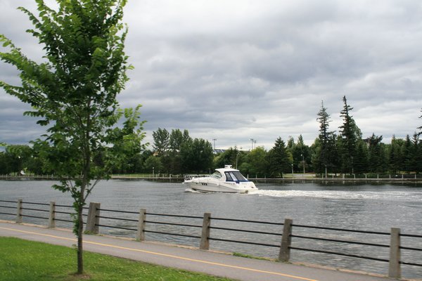 Boat driving down The Rideau Canal