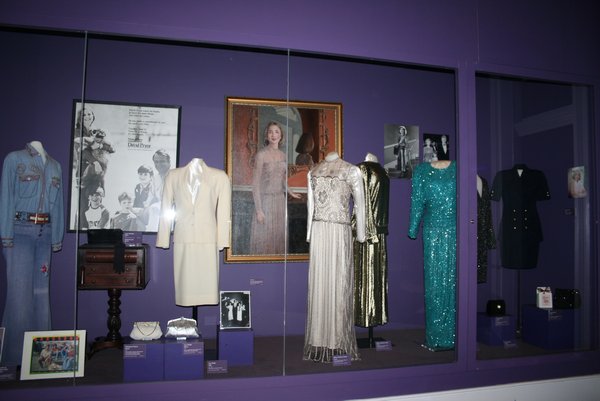Various dresses worn by different Arkansas first ladies.