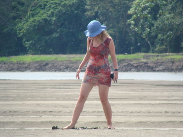 Writing a message on the mud beach!