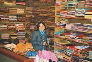 Margaret trying to pick a few scarves for home