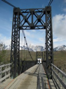 4. The Torres Del Paine ahead walking across a bridge to the start of the 'W'