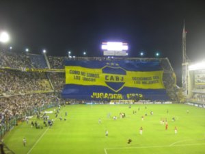 12. Boca fans unfurling a banner which says that they are the 12th man