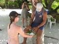 22. Teking scaping the cocunut out of the shell, Maina Island, Aitutaki lagoon