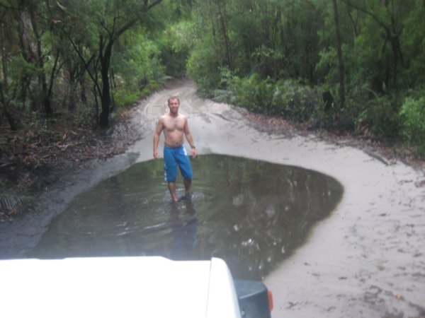 43. Testing the depth of the water on an inland track before driving through, Fraser Island