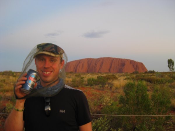 60. The only way to enjoy a beer at Uluru with all the flies around!