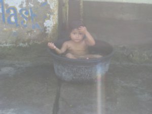 24. A local girl taking a bath, Gili Trawangan