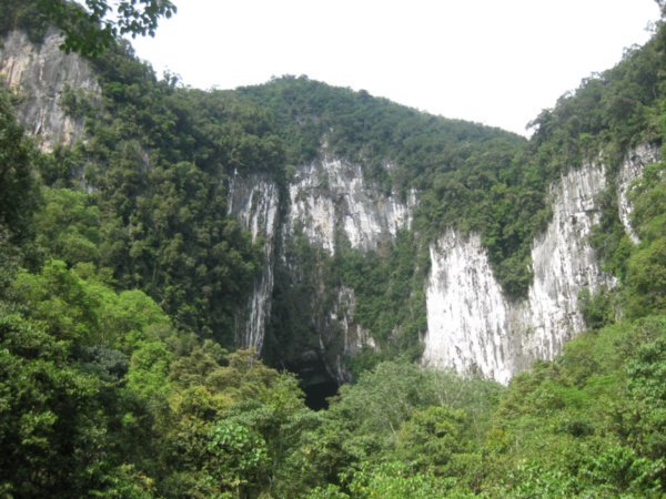 41. The entrance to Deer Cave in the limestone cliffs, Gunung Mulu National Park