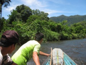 12. Having to get out and push the longboat up some rapids, Gunung Mulu National Park