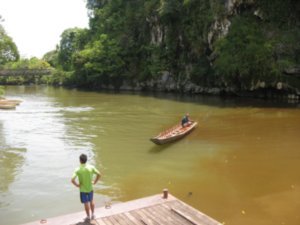 38. Longboat & limestone cliffs, 2 of the key features of Gunung Mulu National Park
