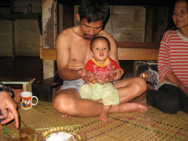 21. Dad teaching son to count to 5 in Malay, longhouse, Pa'Umor village, Kelabit highlands