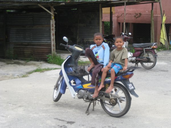 4. Children on a motorbike, Orang Asli village, Cameron Highlands