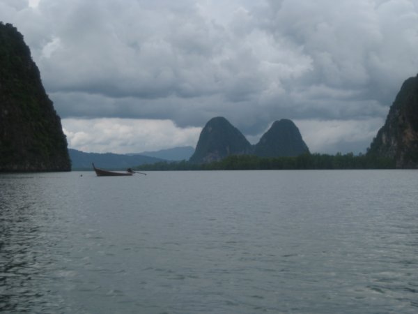 30. A longtail boat sits in Phang Nga Bay