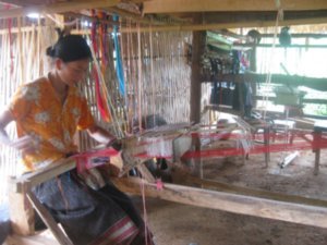 30. Watching a local woman weaving in a village near Phonsavon