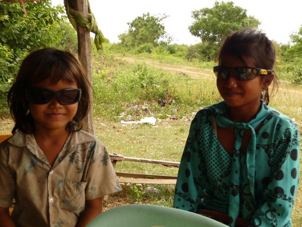 13. Two Cambodian girls wearing our sunglasses, Battambang